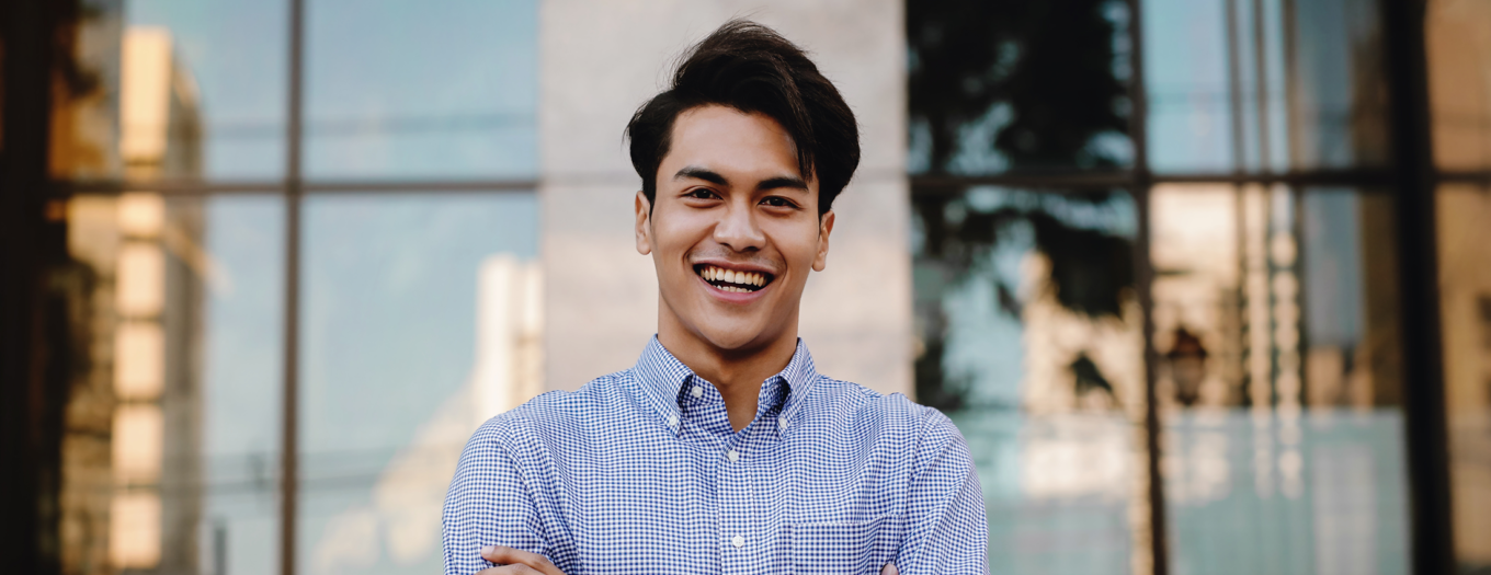 Smiling young man in business casual clothes