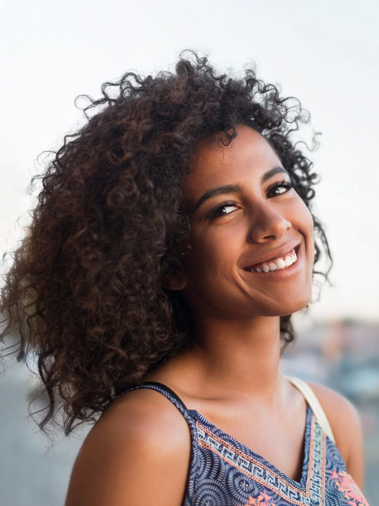 Smiling woman at the beach